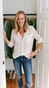 Jess Warren, contributing author at Vlarelie, wearing a white blouse and jeans in Nashville Tennessee